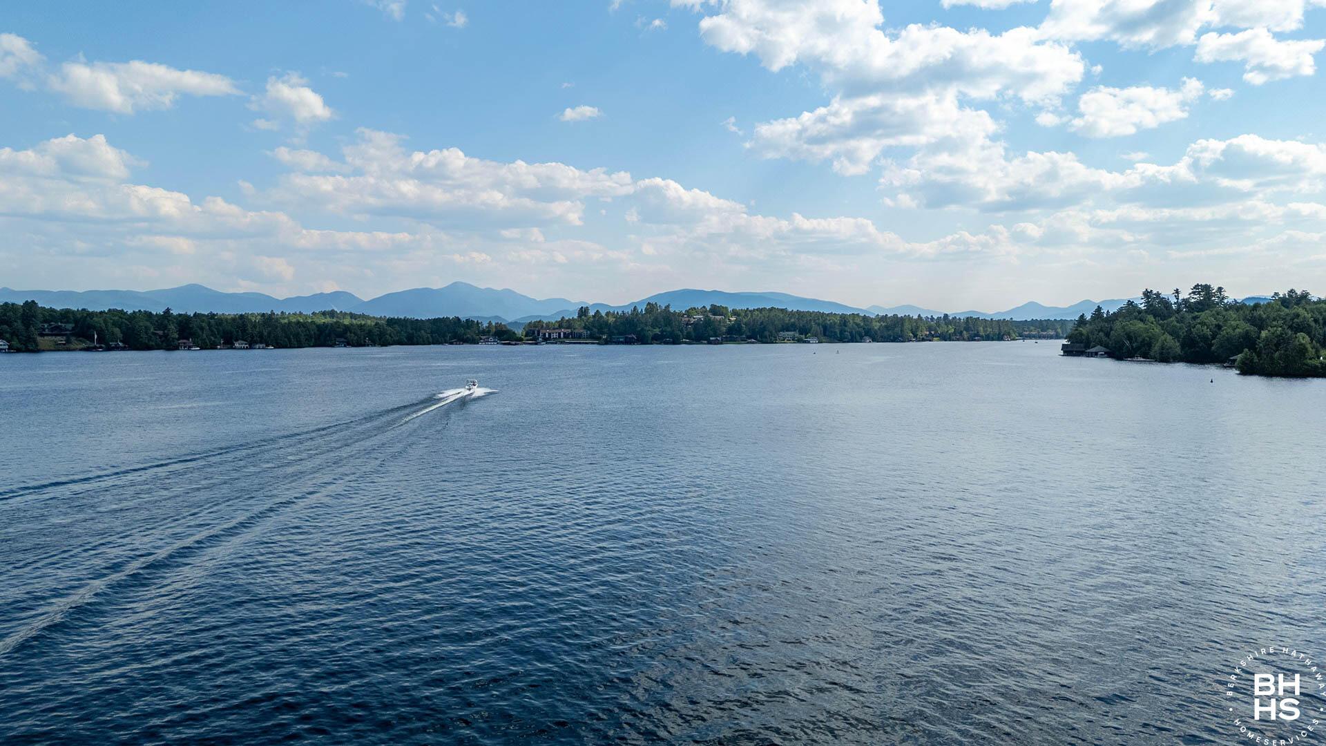 Image 3: CampHighPeaksView_A_Lake_Boat