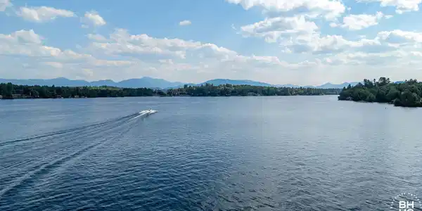 Image 3: CampHighPeaksView_A_Lake_Boat