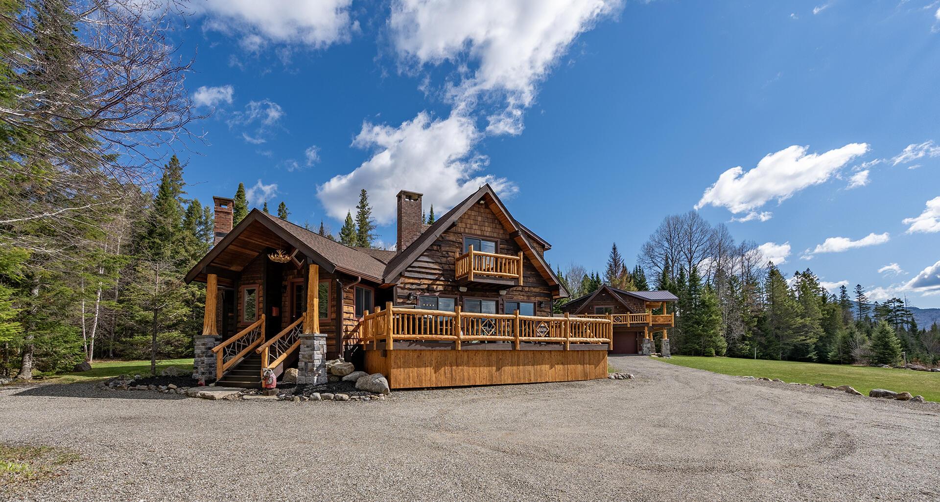 Image 3: LakePlacidHomeOnCoyote_Exterior_MH_C