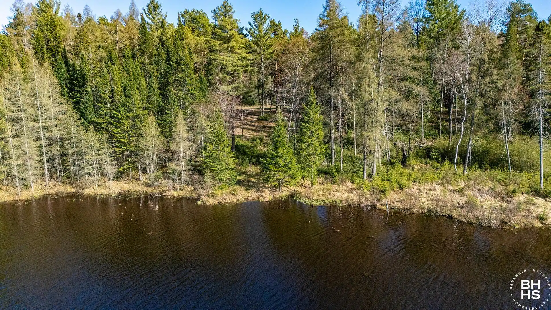 Image 1: Lot1OnLuckyWay_A_Lot_From_Pond