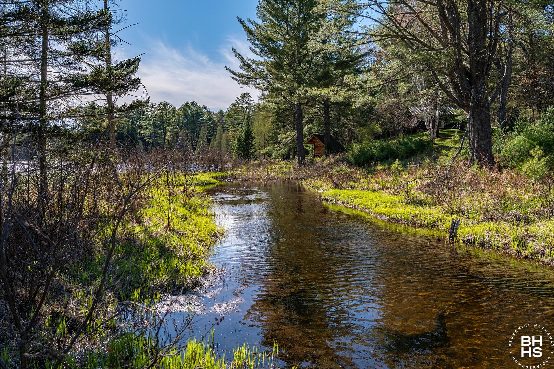 Image 2: Lot1OnLuckyWay_Lot_Pond_From_Bridge_L
