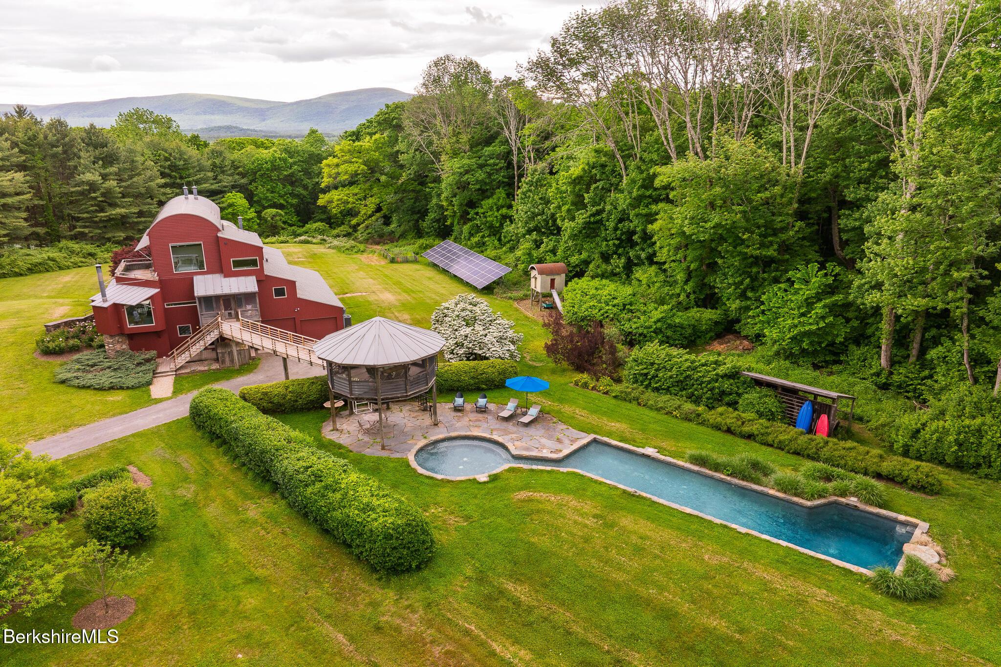 Image 3: Aerial of house with pool