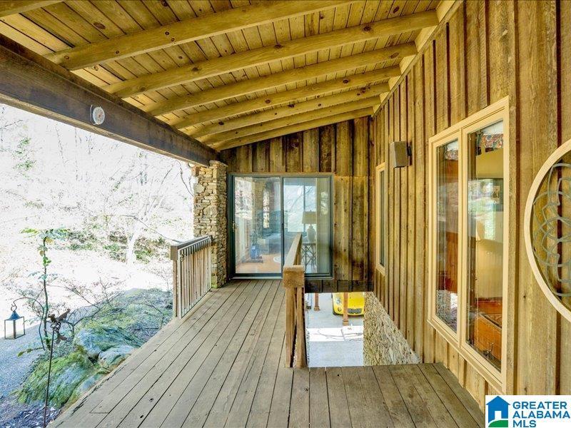 Image 4: Covered porch/stairs to front door from carport