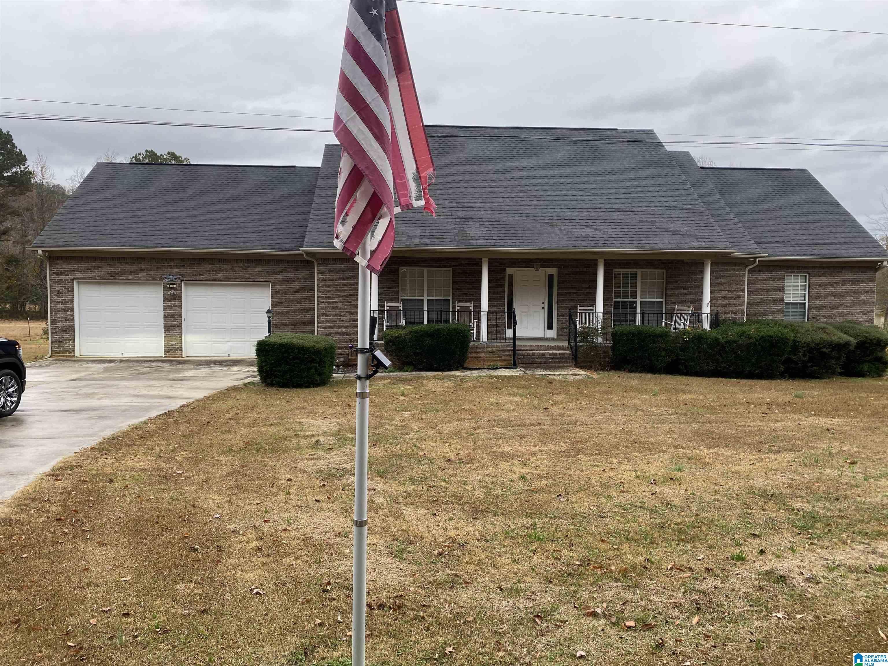 Image 1: Front of house--1 acre lot