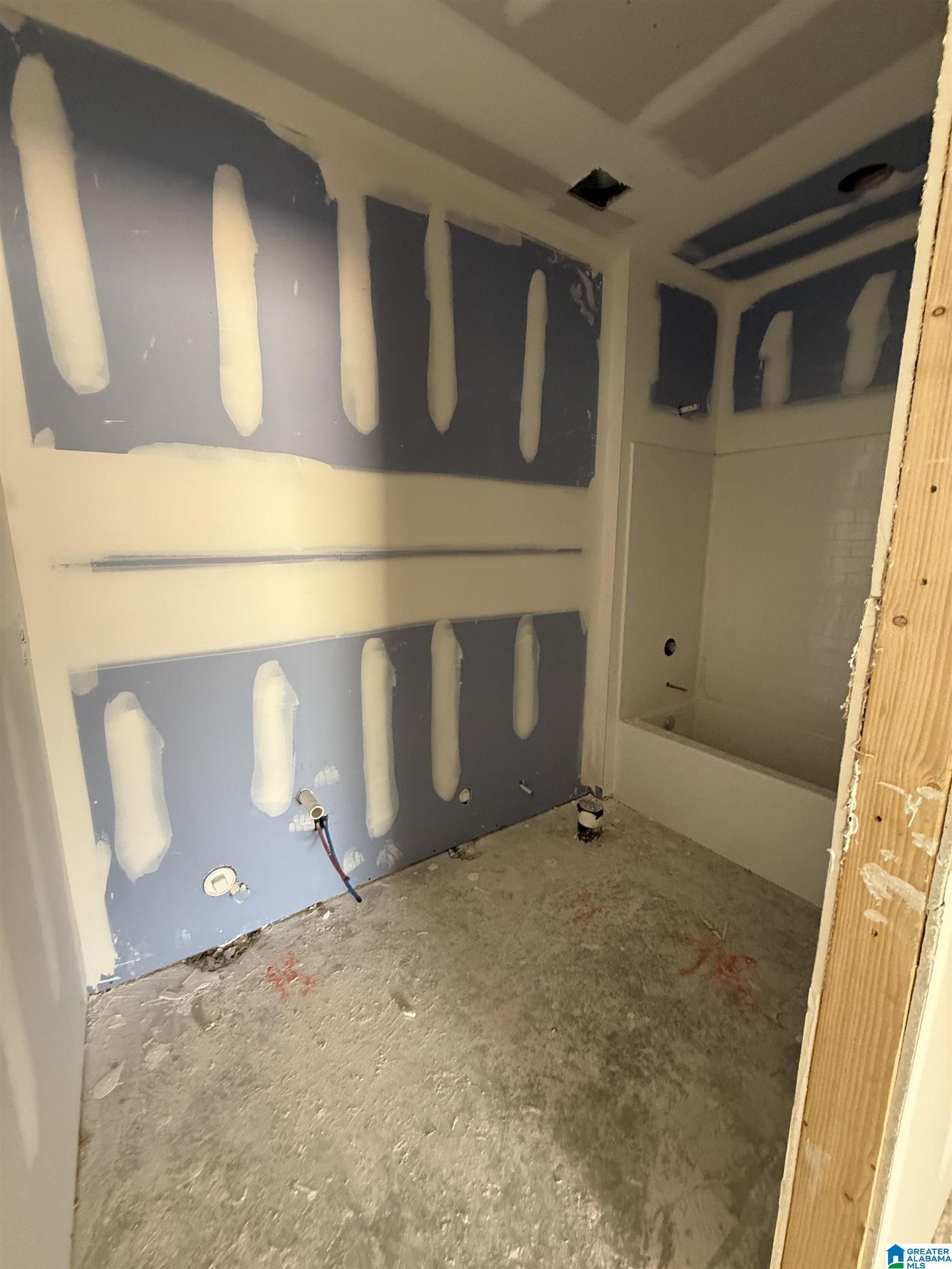 Image 4: Main-level guest bathroom