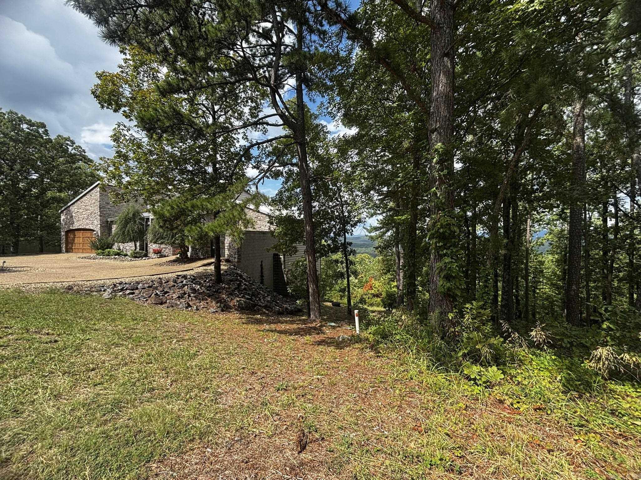 Image 2: House to the left of the lot