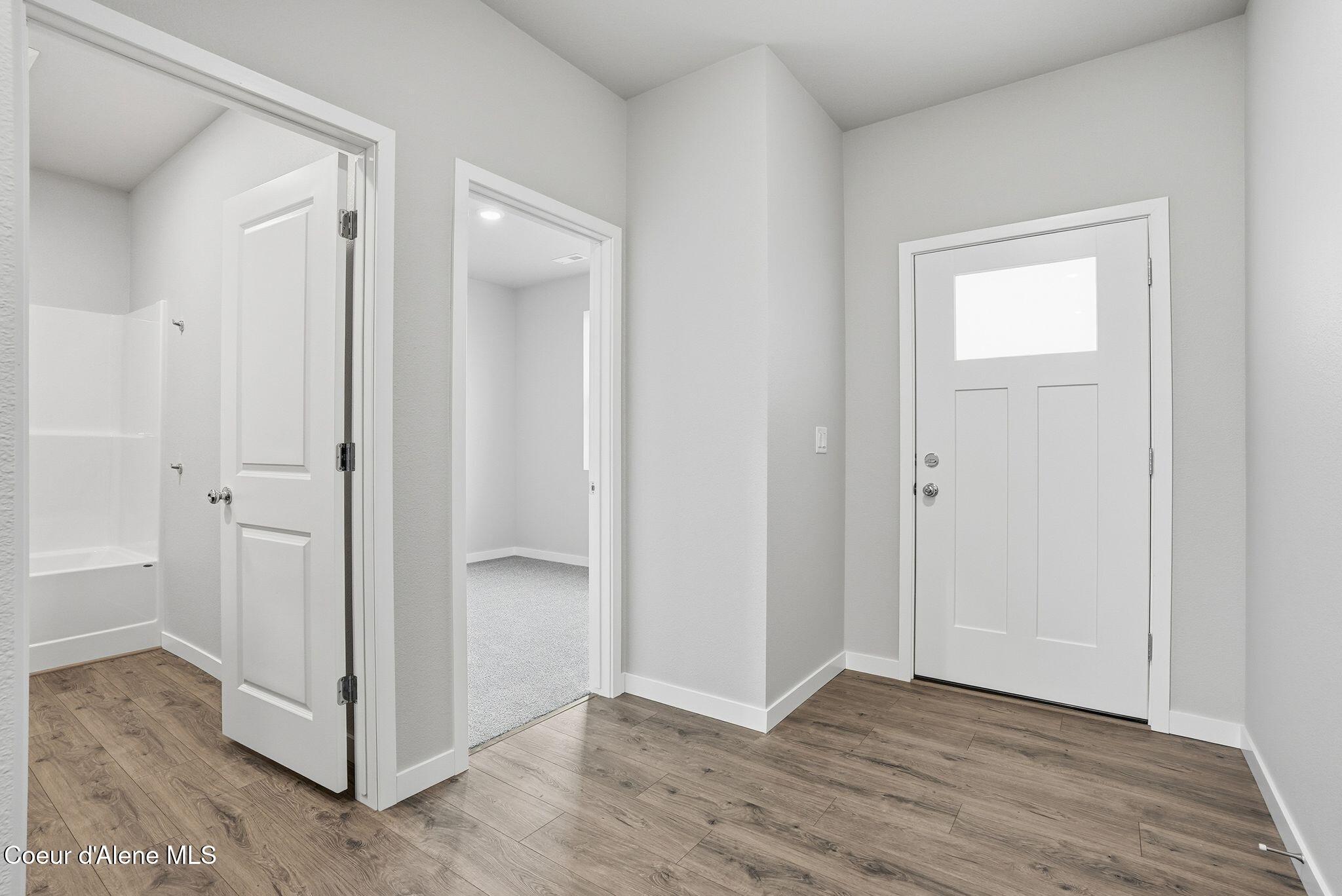 Image 4: Entry to Bedroom 1 and Guest Bath