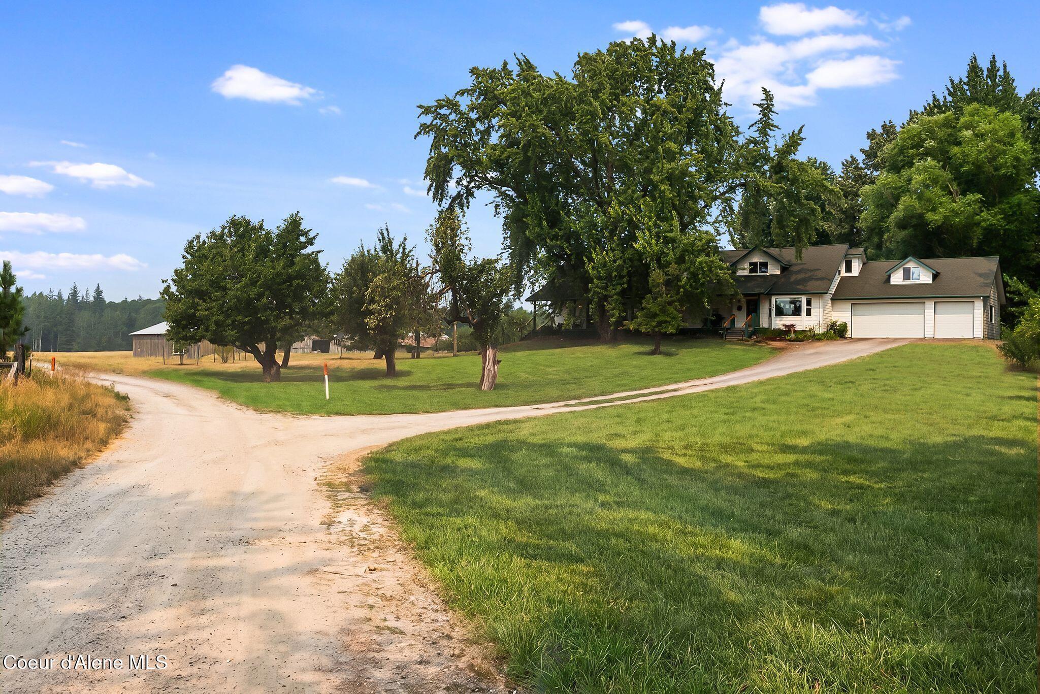 Image 2: Idyllic approach to home and barn