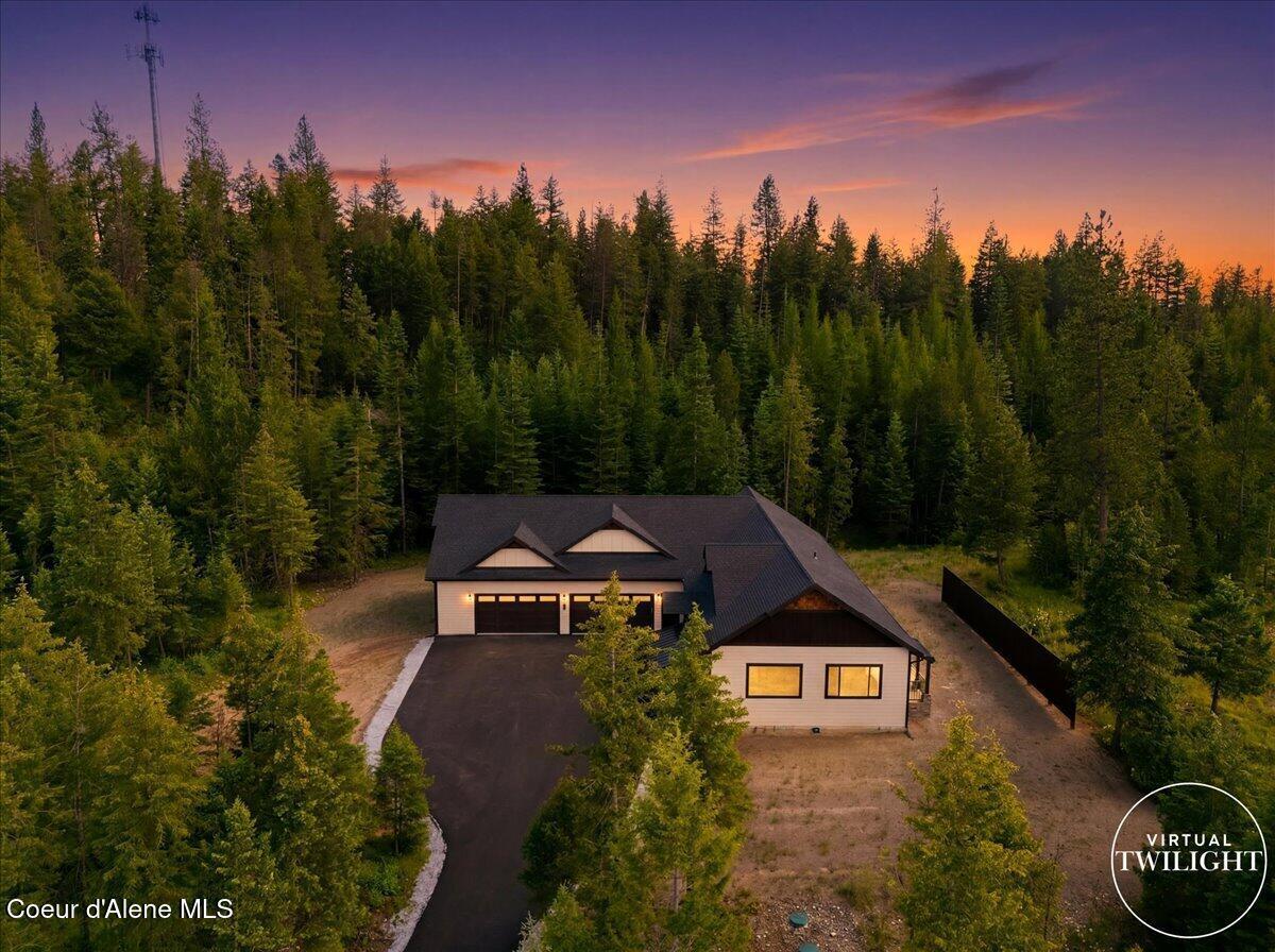 Image 2: Twilight Aerial Front of Home