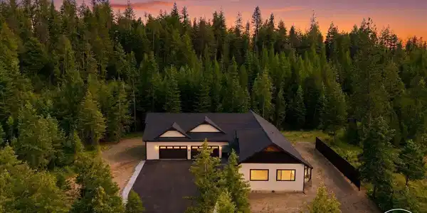 Image 2: Twilight Aerial Front of Home