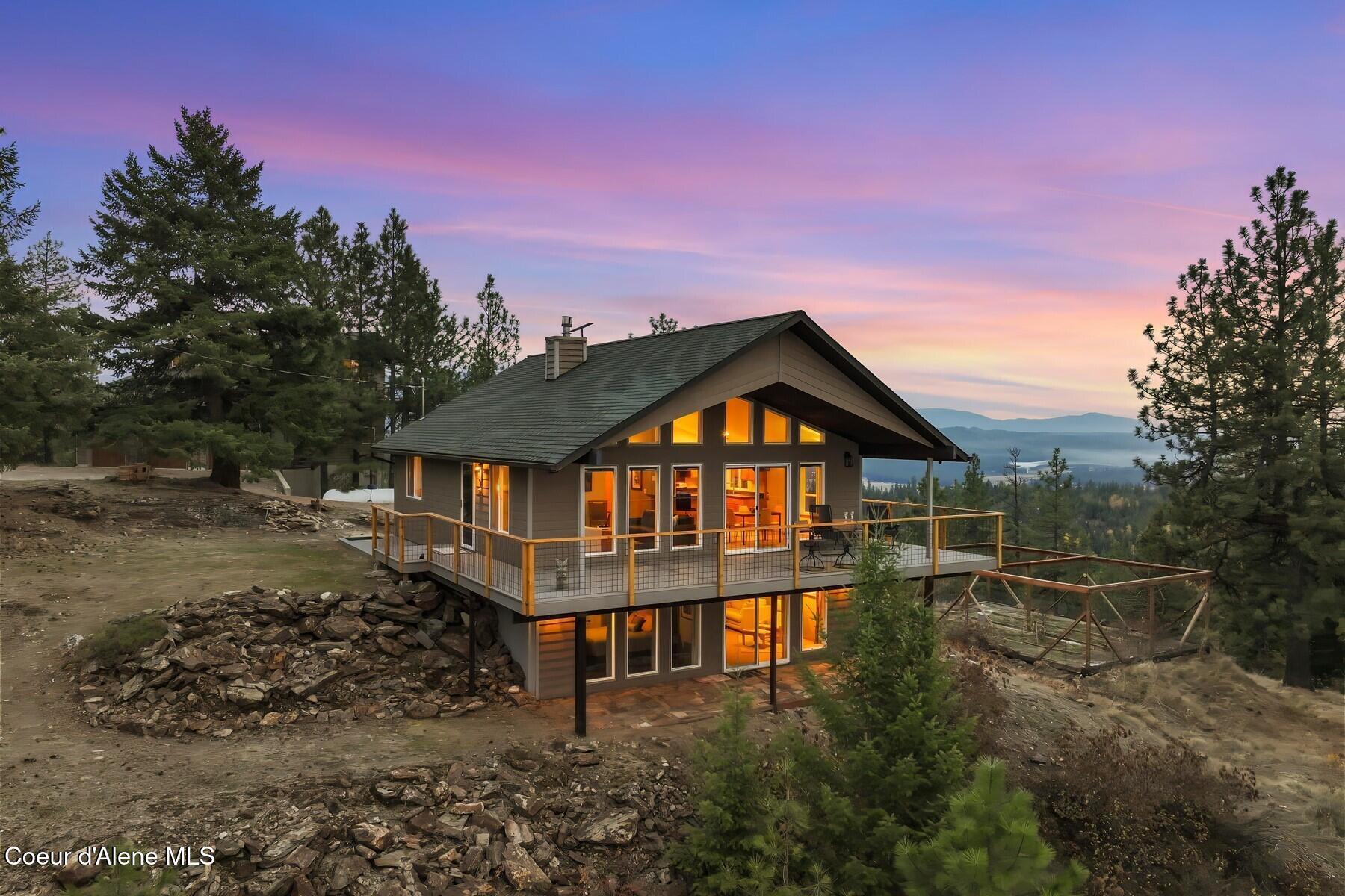 Image 1: Mountain cabin exterior sunset