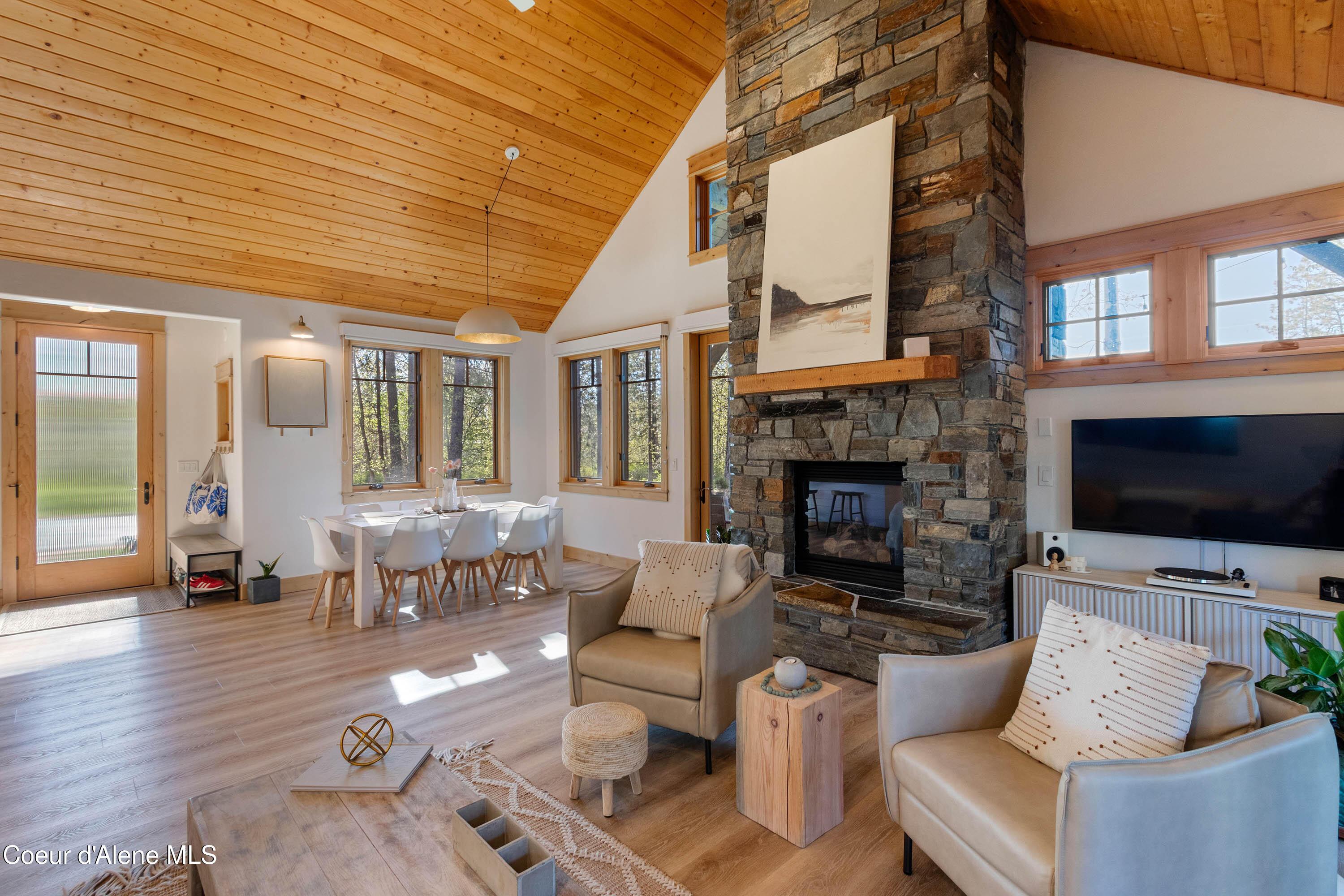 Image 1: Living Room to Dining and Entry