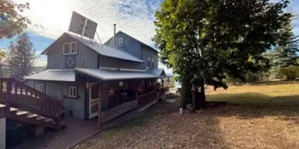Image 2: photo of house from rock