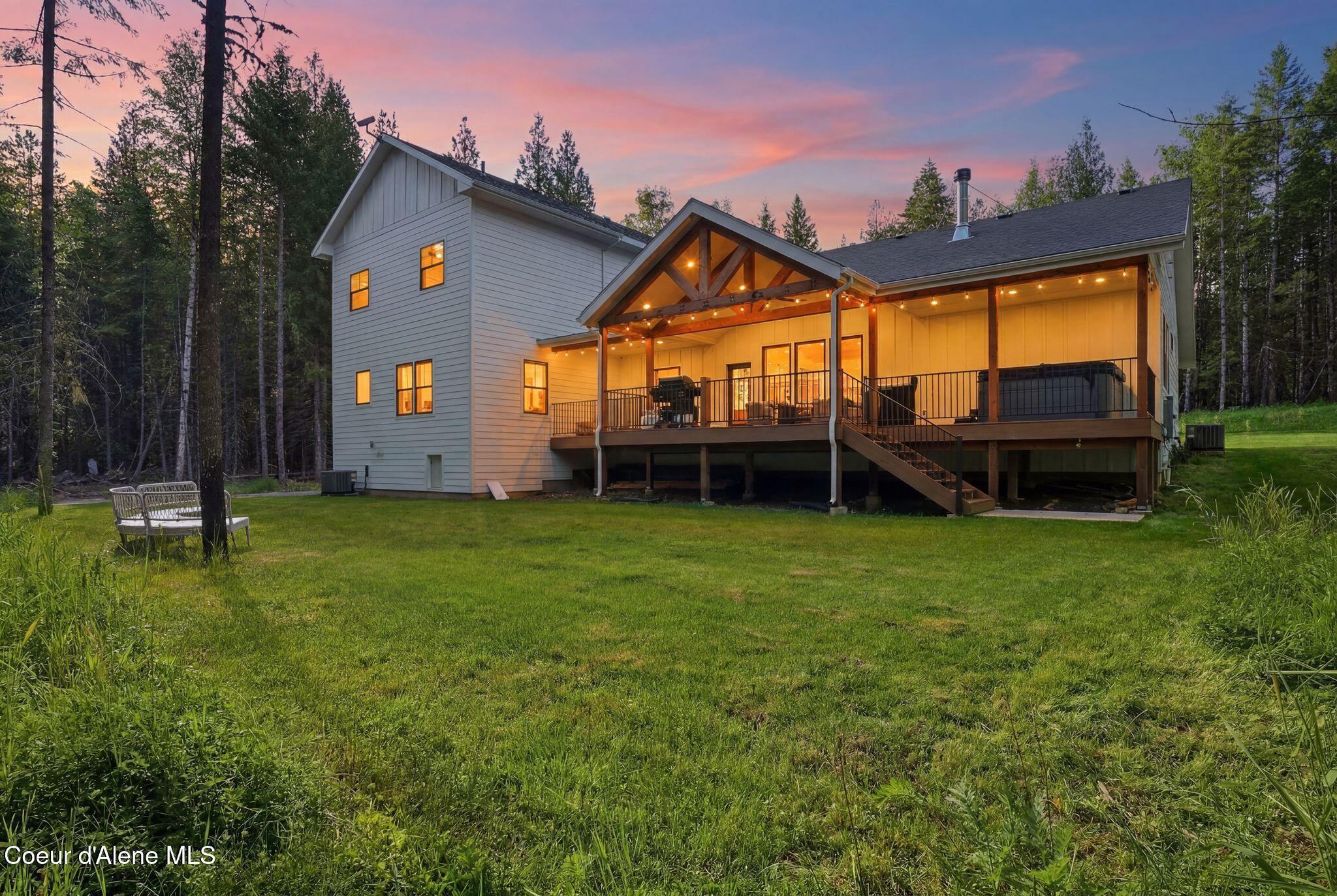 Image 4: Back Exterior at Dusk
