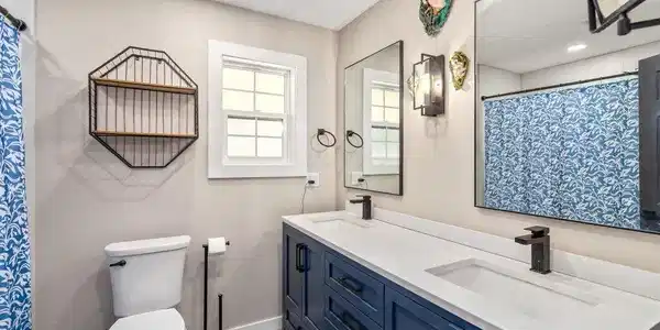 Image 4: Dual Vanities + Tub Surround