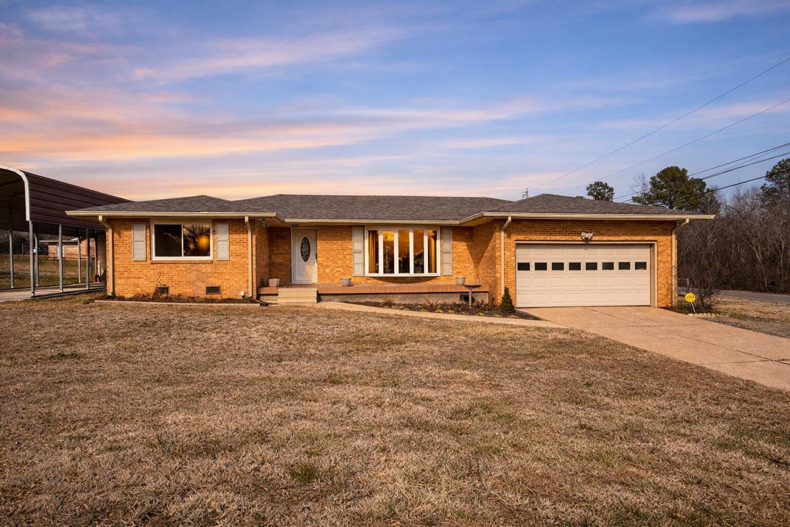Image 1: Twilight over a mid-century ranch house