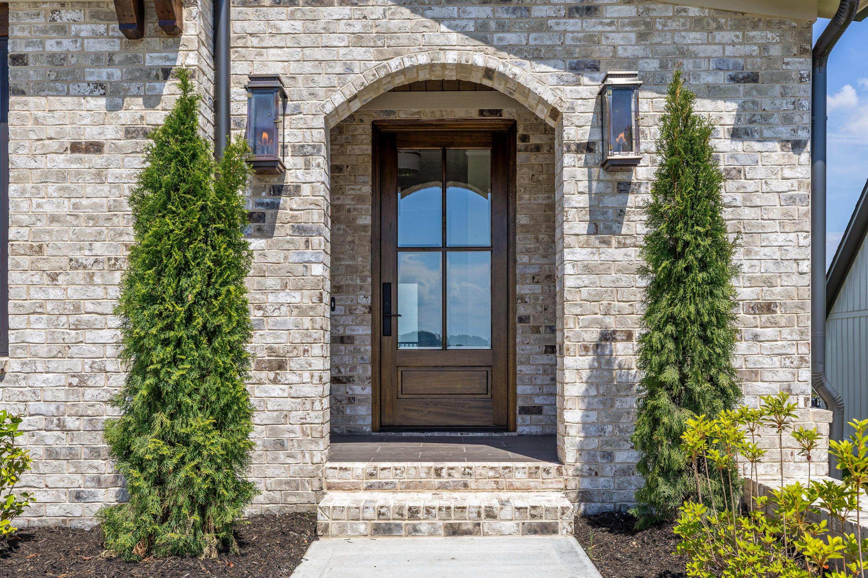 Image 2: Arched front porch entry