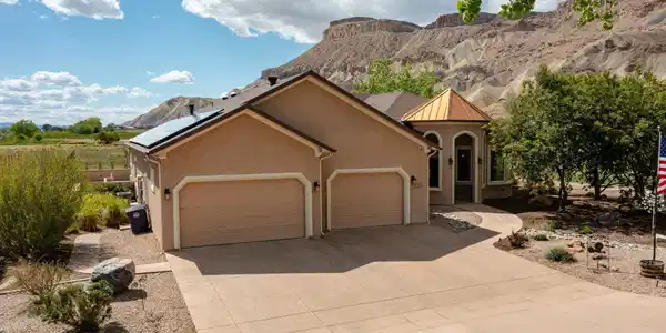 Image 3: Attached three car garage