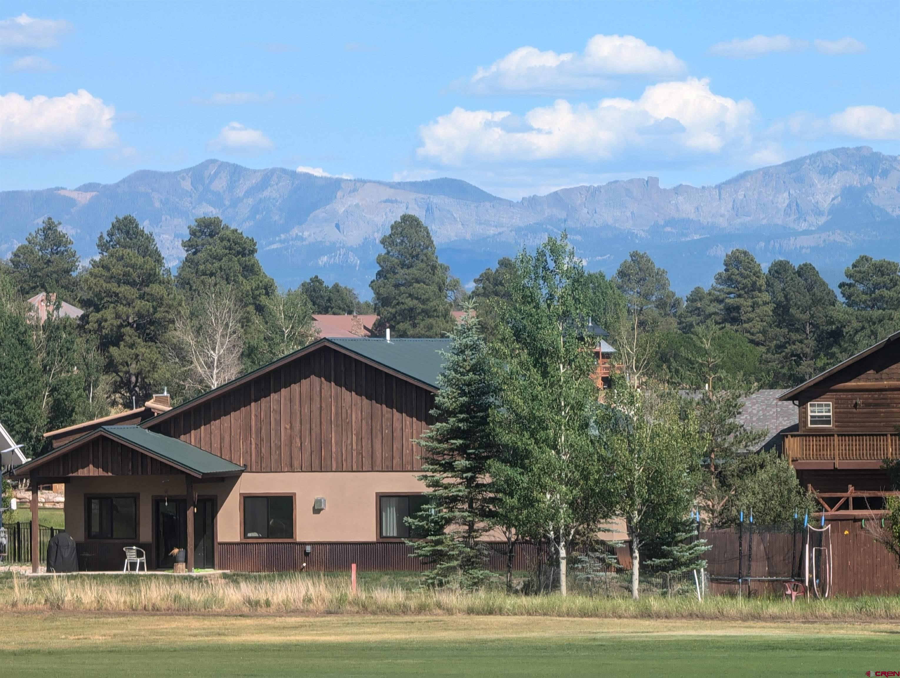 Image 3: golf course side of the home
