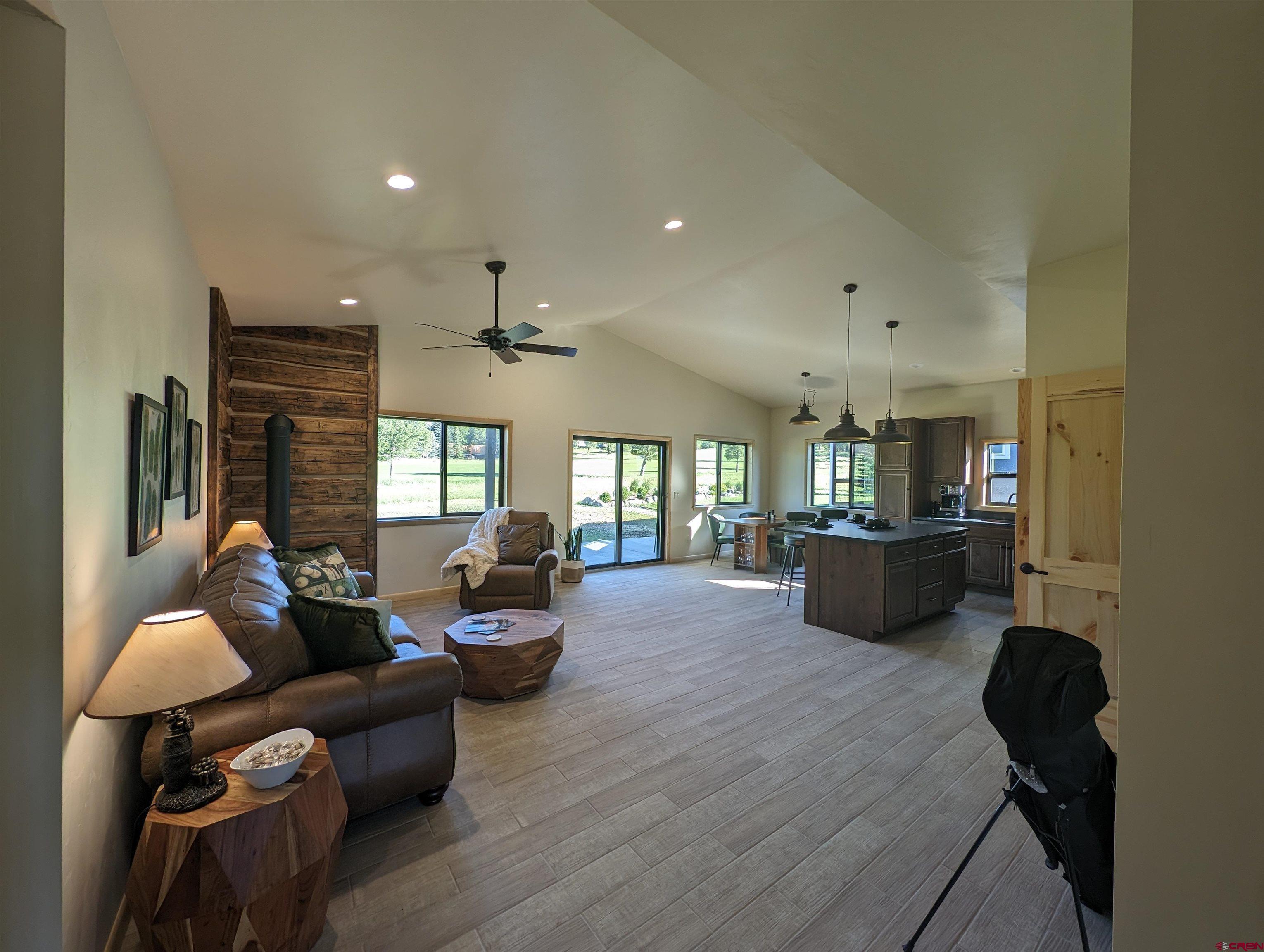 Image 4: wood look tile flooring throughout this home