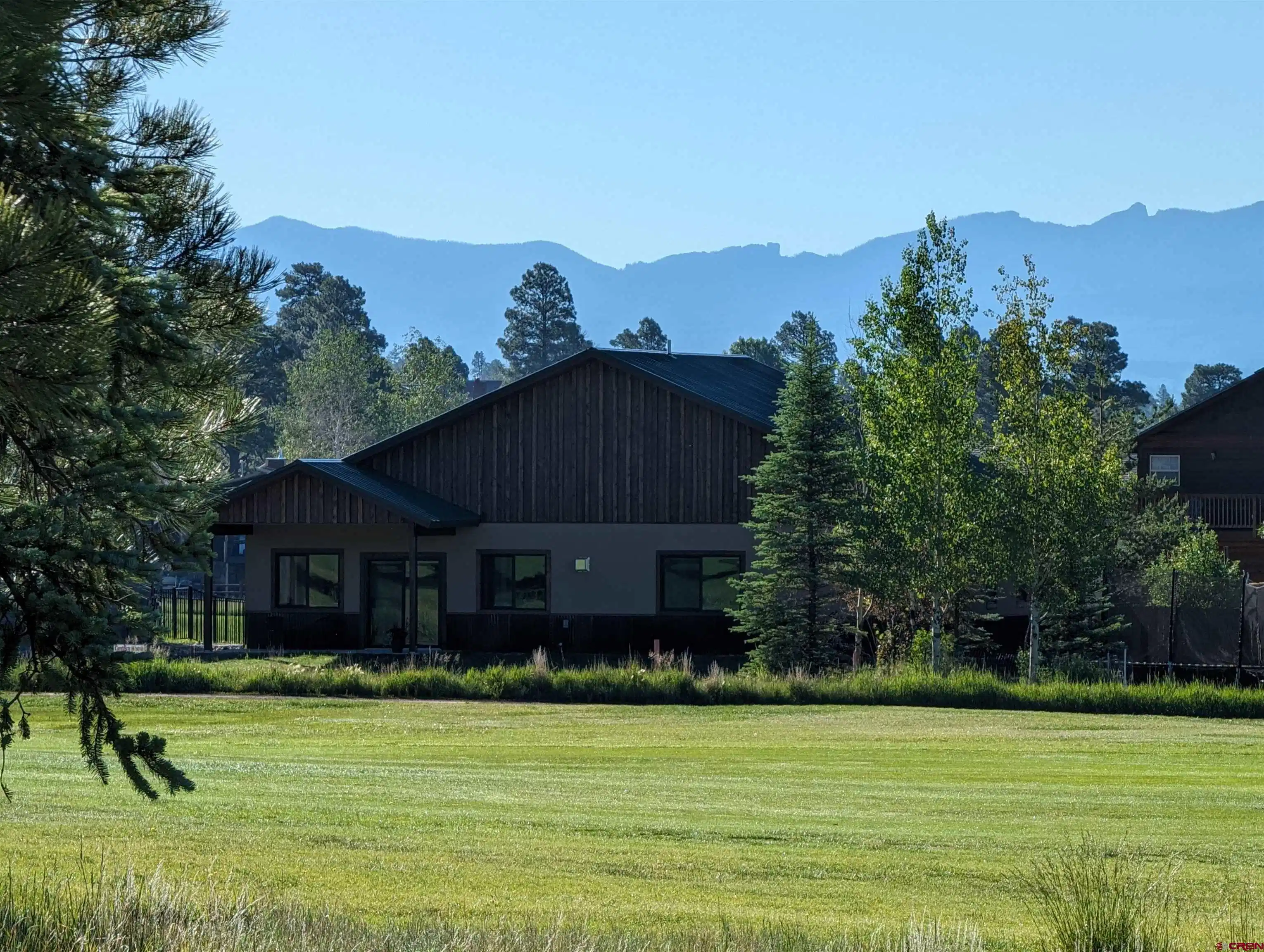 Image 1: early morning on the back side of the home on the golf cours