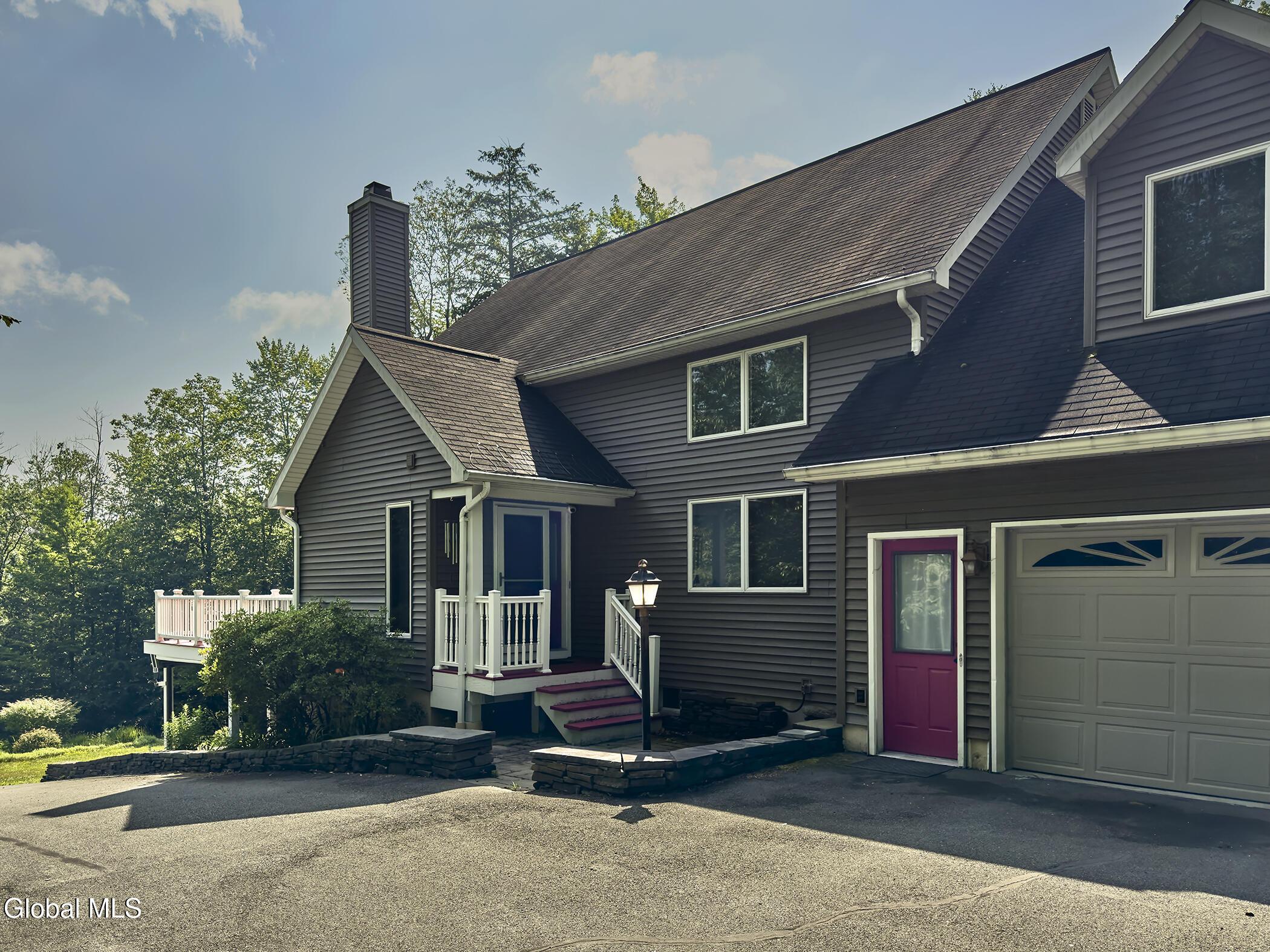 Image 3: Front door access and Garage