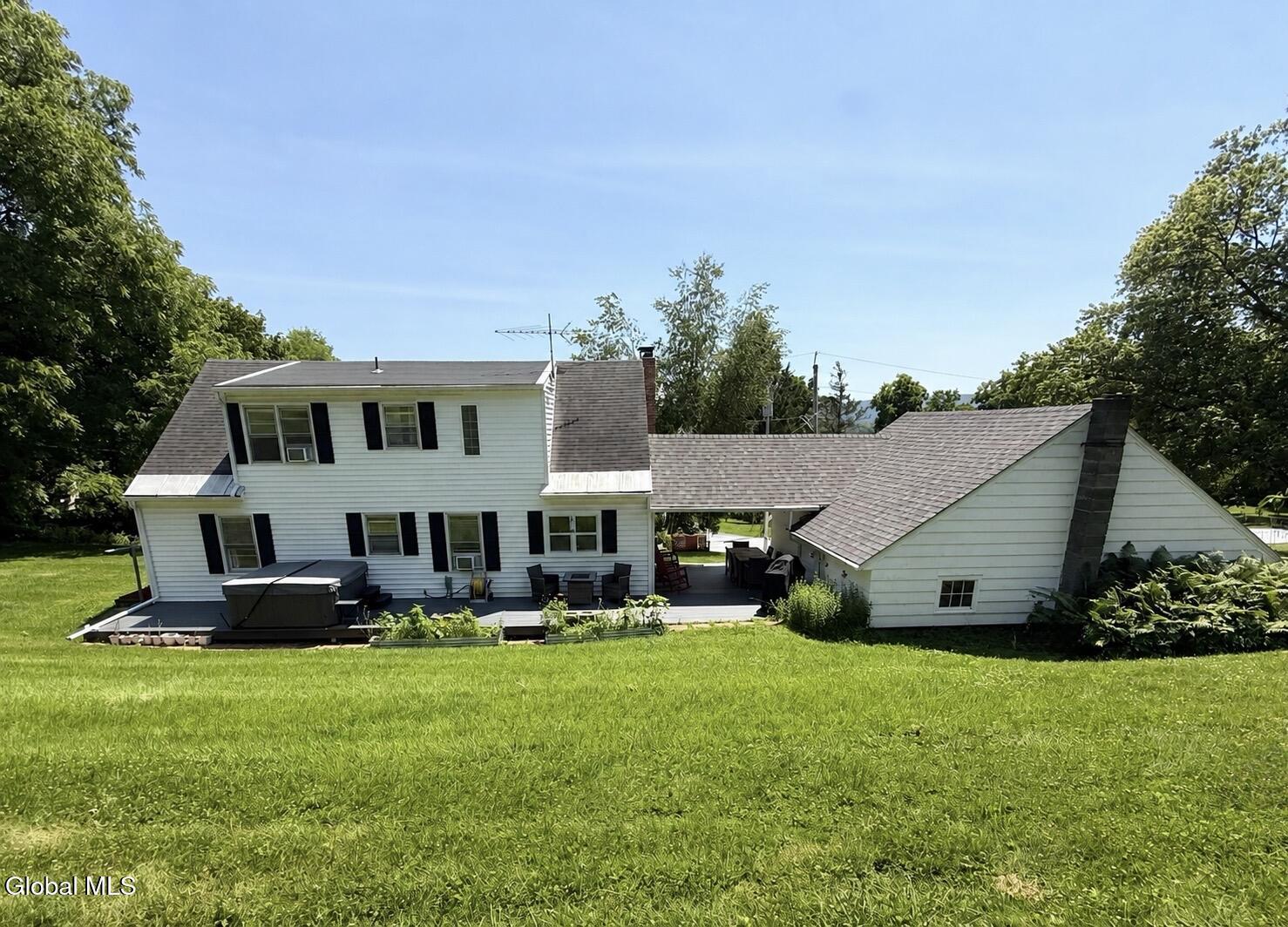 Image 1: View of Home From Backyard