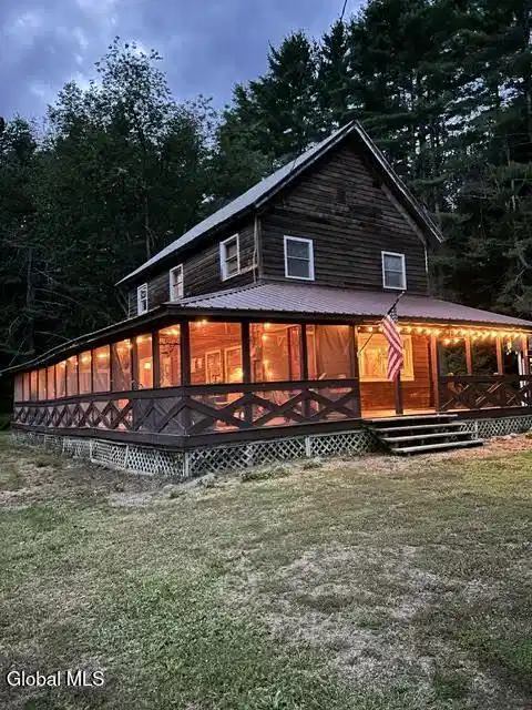 Image 1: screen porch at night