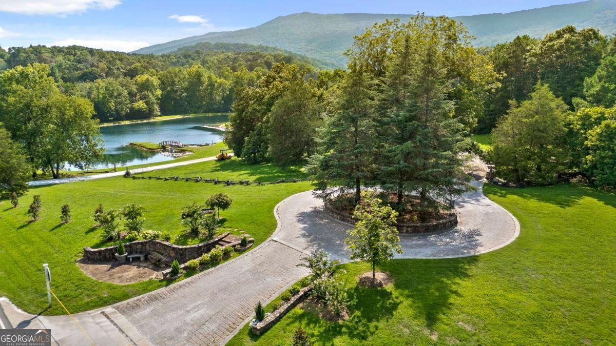 Image 2: Front gate with view of Cloudland Station's Lake Angela.
