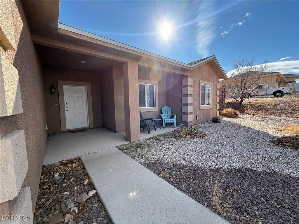 Image 1: Entrance to property with a patio area