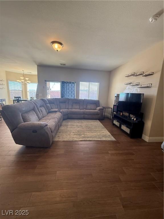 Image 2: Living room featuring LVP flooring