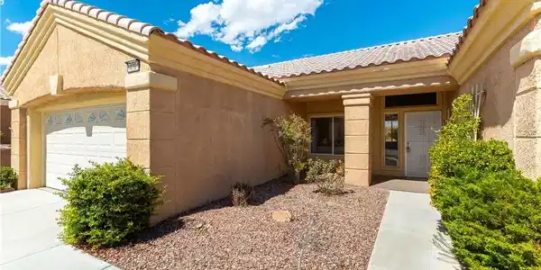 Image 2: The two car garage with a golf cart parking/worksh