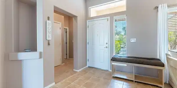 Image 3: A white metal security door and a white solid wood