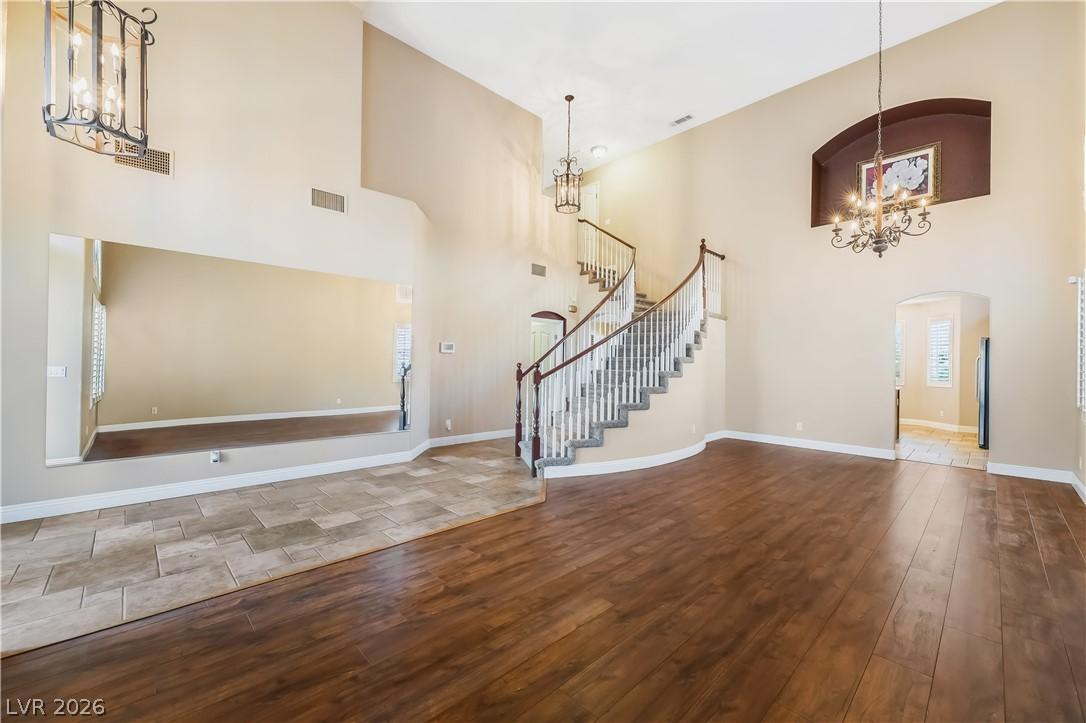 Image 4: Grand foyer with soaring ceilings, a graceful curv