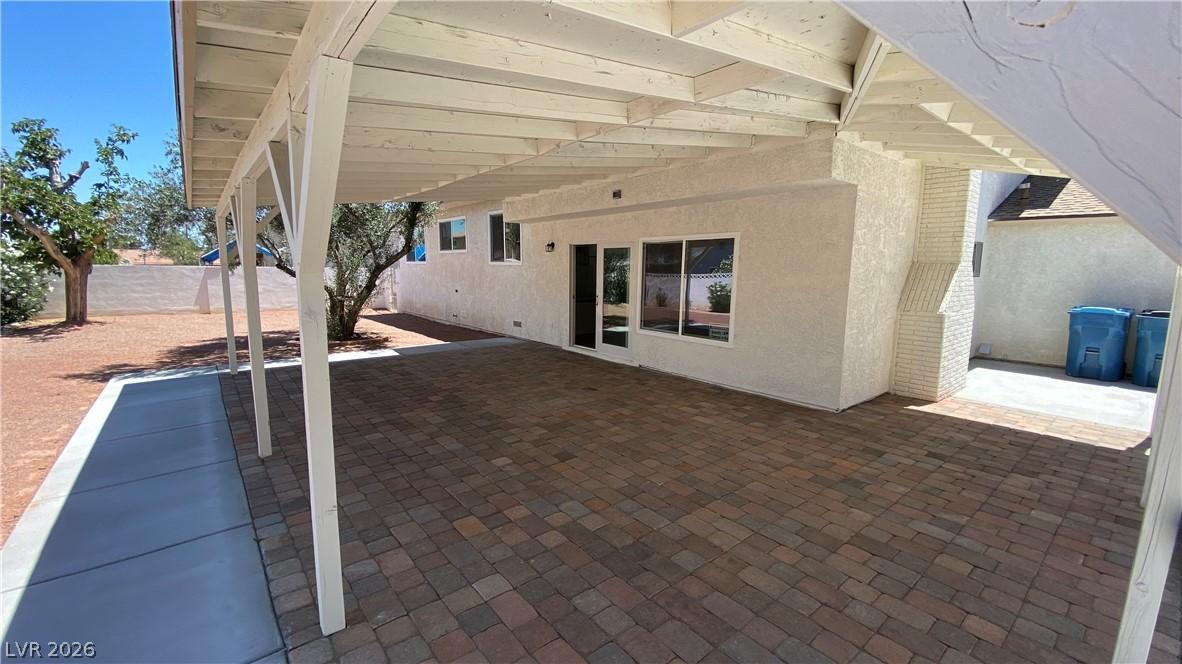 Image 2: This inviting patio area features durable paver fl