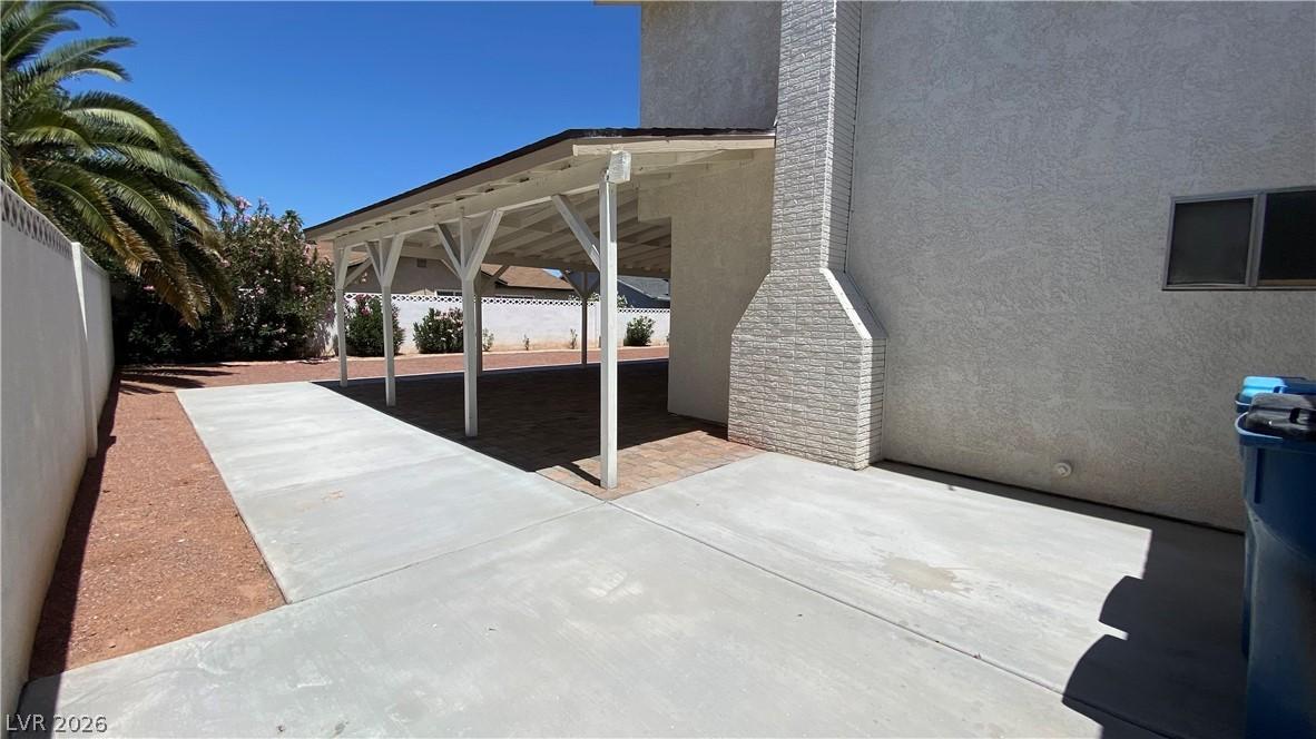 Image 4: This property features a covered patio perfect for