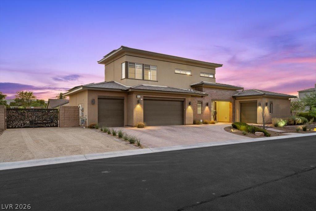 Image 2: Modern desert architecture with multiple garage ba
