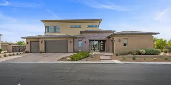 Image 4: A modern facade with stacked stone accents and a p