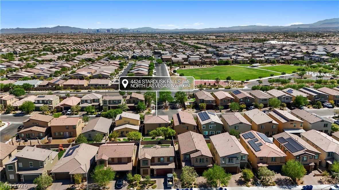 Image 4: An aerial perspective reveals a vast neighborhood