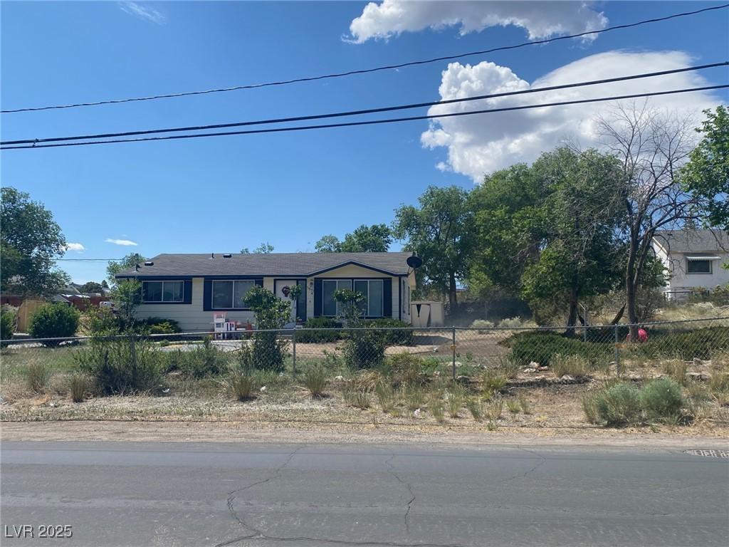 Image 3: Ranch-style home featuring a fenced front yard