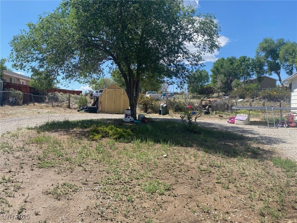 Image 4: View of yard with a storage shed