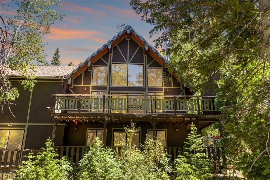Image 2: A charming A-frame chalet, featuring a generous ba