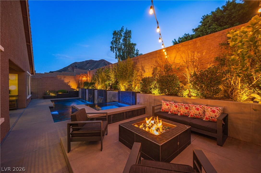 Image 1: An inviting backyard oasis offers a sparkling pool