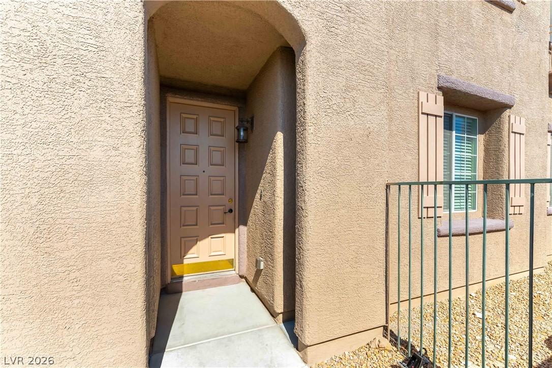 Image 3: The inviting entrance features a warm-toned door a