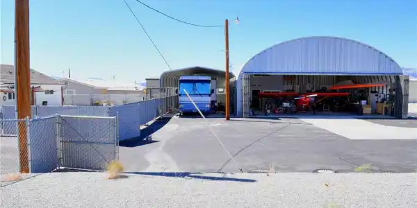 Image 3: This property features a spacious quonset hut, ide
