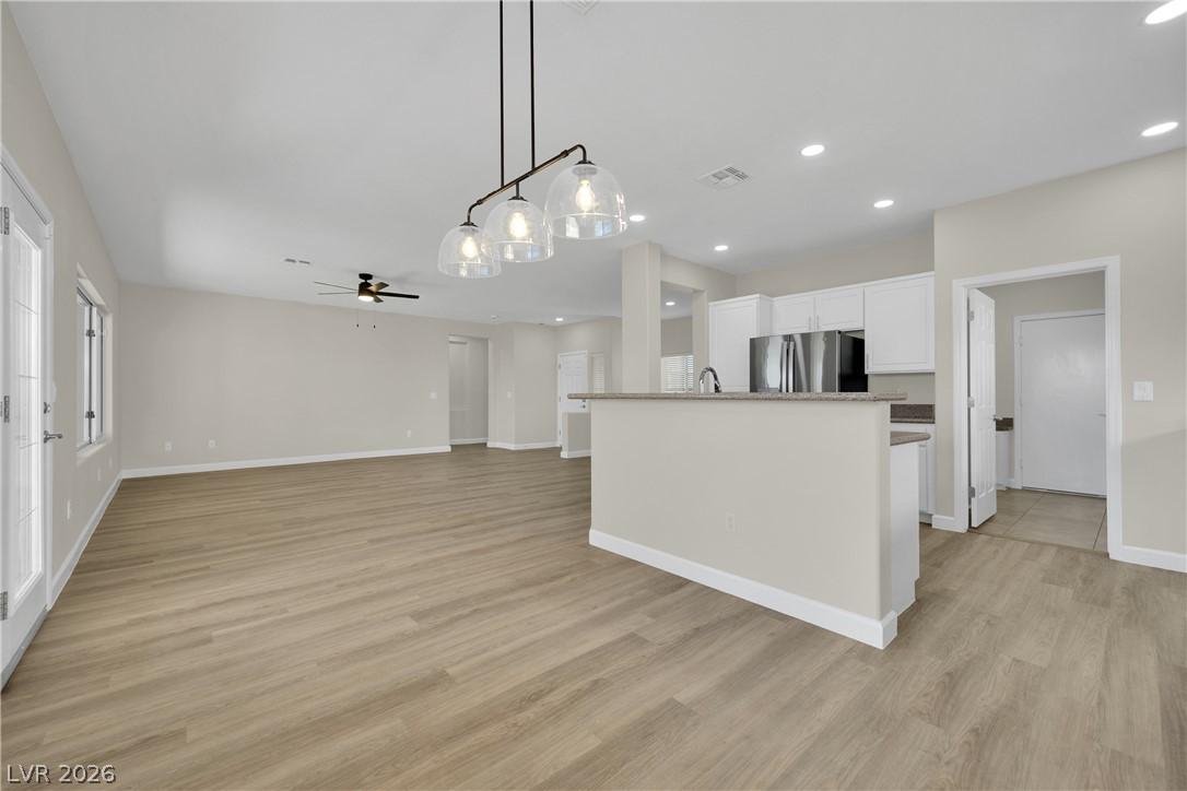 Image 3: An open floorplan living area flows seamlessly int