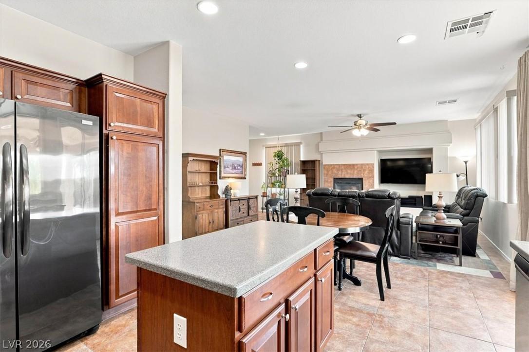 Image 4: An inviting open-concept layout showcases a kitche