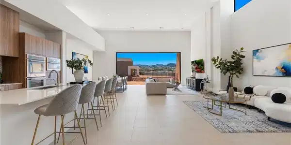 Image 2: An open-concept living space with elevated ceiling