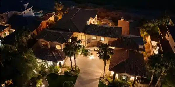 Image 2: An aerial nighttime perspective reveals a grand es