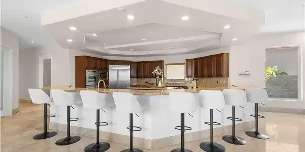 Image 3: An inviting kitchen with a substantial island and